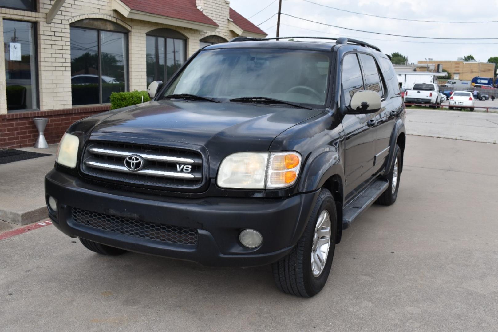 2004 Black /Black Toyota Sequoia Limited 2WD (5TDZT38A14S) with an 4.7L V8 DOHC 32V engine, 4-Speed Automatic Overdrive transmission, located at 5925 E. BELKNAP ST., HALTOM CITY, TX, 76117, (817) 834-4222, 32.803799, -97.259003 - Photo#1