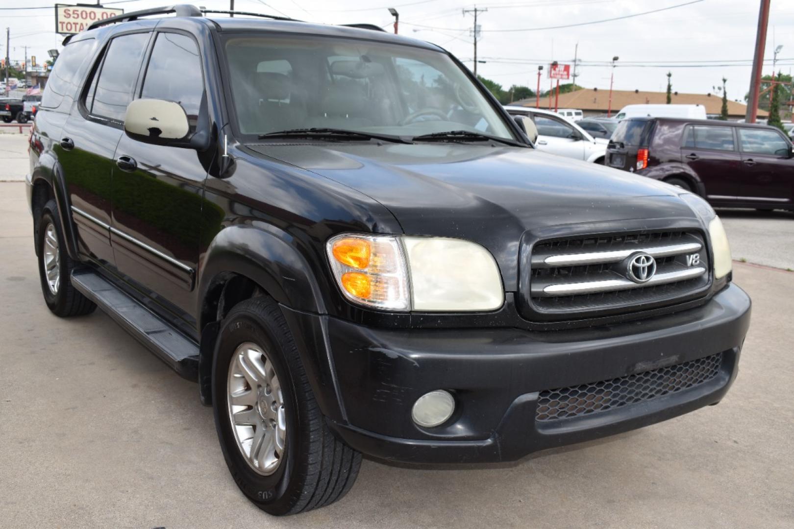 2004 Black /Black Toyota Sequoia Limited 2WD (5TDZT38A14S) with an 4.7L V8 DOHC 32V engine, 4-Speed Automatic Overdrive transmission, located at 5925 E. BELKNAP ST., HALTOM CITY, TX, 76117, (817) 834-4222, 32.803799, -97.259003 - Photo#2