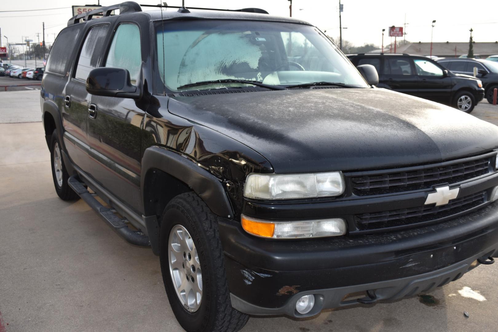 2003 Black /Beige Chevrolet Suburban 1500 4WD (3GNFK16Z13G) with an 5.3L V8 OHV 16V FFV engine, 4-Speed Automatic Overdrive transmission, located at 5925 E. BELKNAP ST., HALTOM CITY, TX, 76117, (817) 834-4222, 32.803799, -97.259003 - [Scene: A picturesque suburban neighborhood on a sunny day. The camera pans through lush lawns and beautiful homes.] Narrator (V.O.): Welcome to the heart of the suburbs, where life is all about family, adventure, and making memories that last a lifetime. [Cut to a driveway, where a well-maintaine - Photo#2