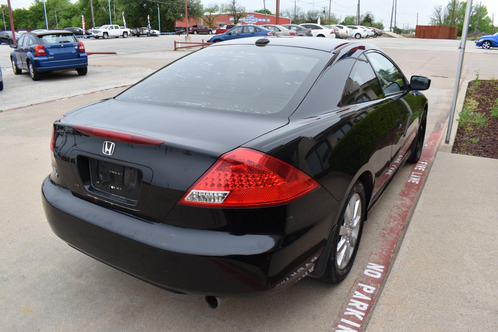 2006 Black /Black Honda Accord EX V-6 Coupe AT w/ XM Radio (1HGCM82626A) with an 3.0L V6 SOHC 24V engine, 5-Speed Automatic Overdrive transmission, located at 5925 E. BELKNAP ST., HALTOM CITY, TX, 76117, (817) 834-4222, 32.803799, -97.259003 - Purchasing a 2006 Honda Accord EX V-6 Coupe AT with XM Radio offers several compelling reasons: Reliability: Honda is renowned for building reliable vehicles, and the 2006 Accord is no exception. It's known for its longevity and low maintenance costs, providing peace of mind for years to come. Pow - Photo#4