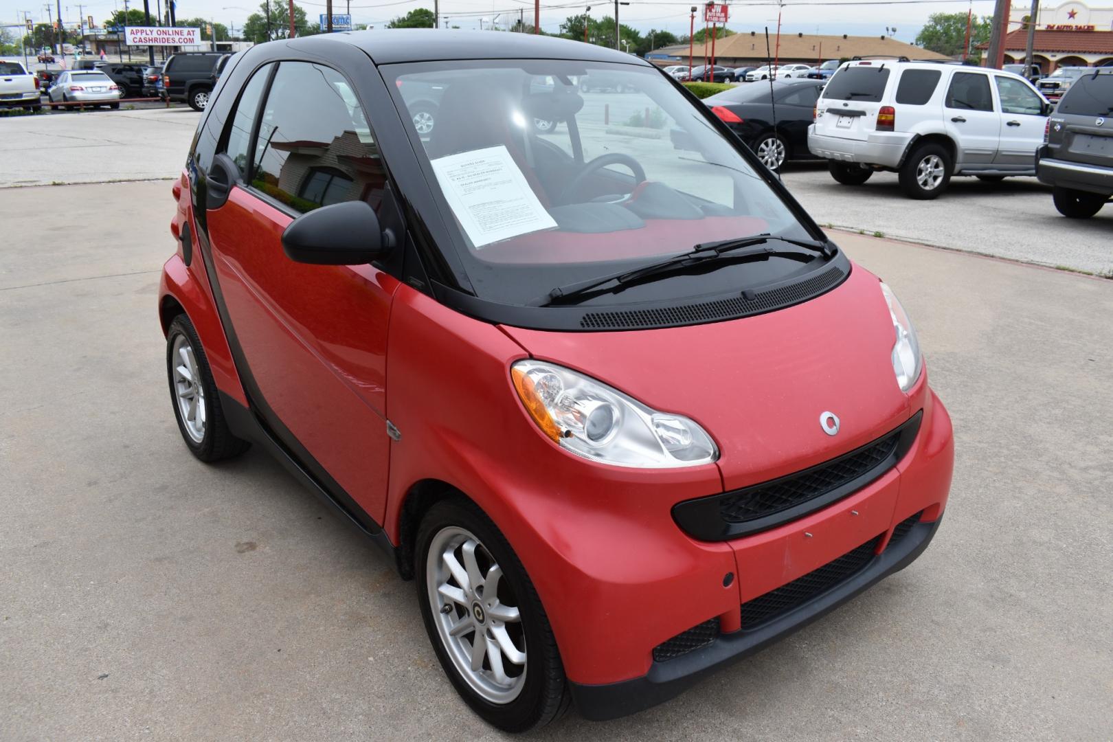 2009 Red /Red smart Fortwo Passion (WMEEJ31X69K) with an 1.0L L3 DOHC 12V engine, 5-Speed Manual transmission, located at 5925 E. BELKNAP ST., HALTOM CITY, TX, 76117, (817) 834-4222, 32.803799, -97.259003 - Purchasing a 2009 Smart Fortwo Passion can be an interesting and practical choice for certain individuals and driving scenarios. Here are some reasons why you might consider buying one: Compact Size: The Smart Fortwo is incredibly compact, making it ideal for urban environments with limited parking - Photo#1