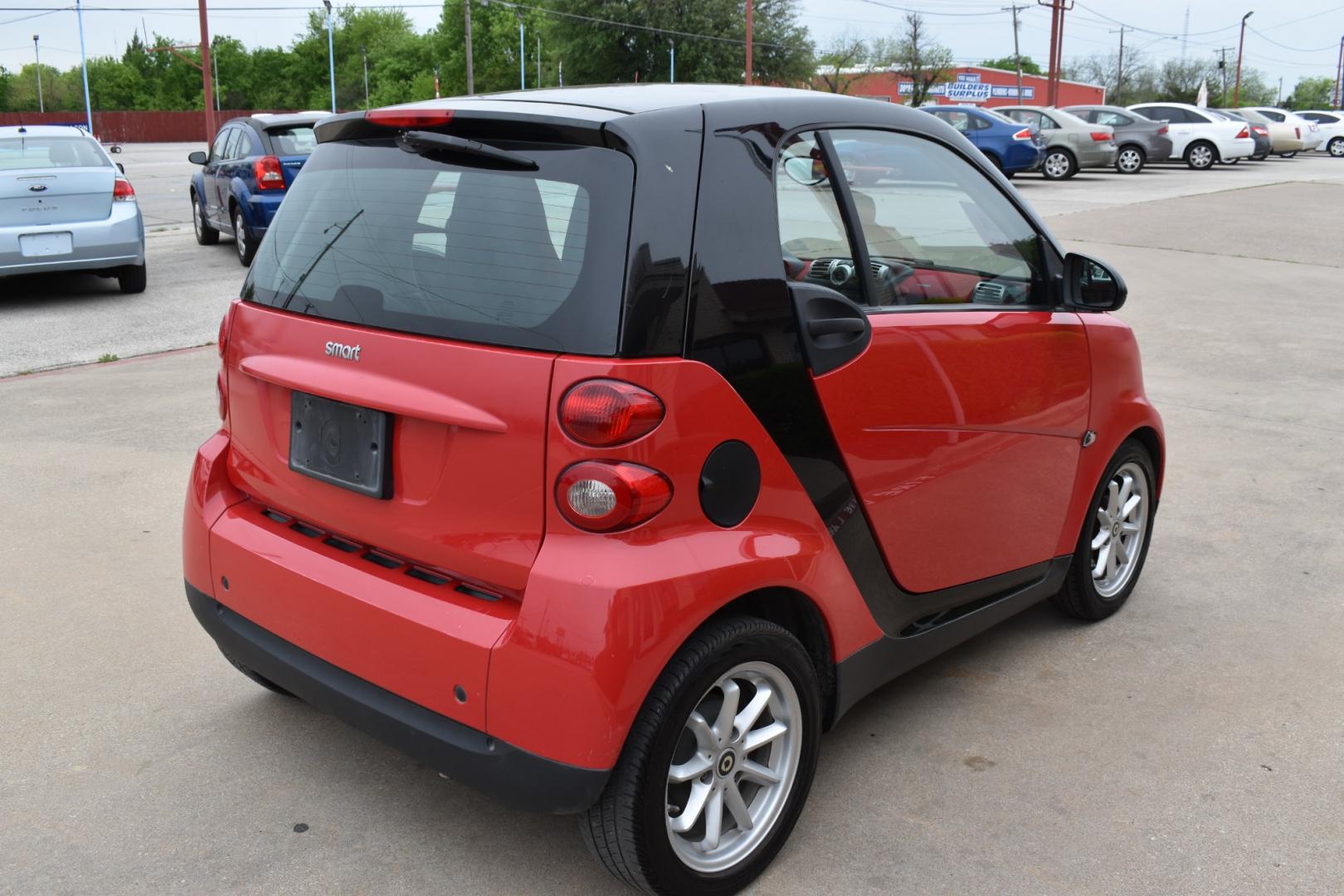 2009 Red /Red smart Fortwo Passion (WMEEJ31X69K) with an 1.0L L3 DOHC 12V engine, 5-Speed Manual transmission, located at 5925 E. BELKNAP ST., HALTOM CITY, TX, 76117, (817) 834-4222, 32.803799, -97.259003 - Photo#3