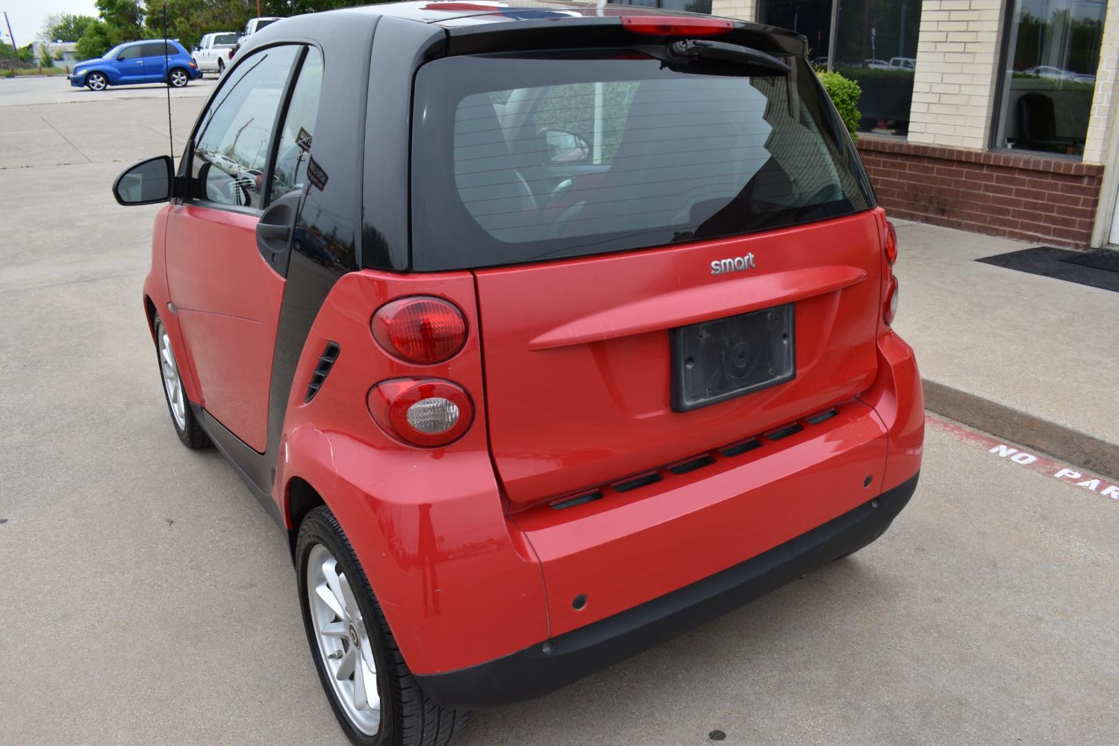 2009 Red /Red smart Fortwo Passion (WMEEJ31X69K) with an 1.0L L3 DOHC 12V engine, 5-Speed Manual transmission, located at 5925 E. BELKNAP ST., HALTOM CITY, TX, 76117, (817) 834-4222, 32.803799, -97.259003 - Photo#4