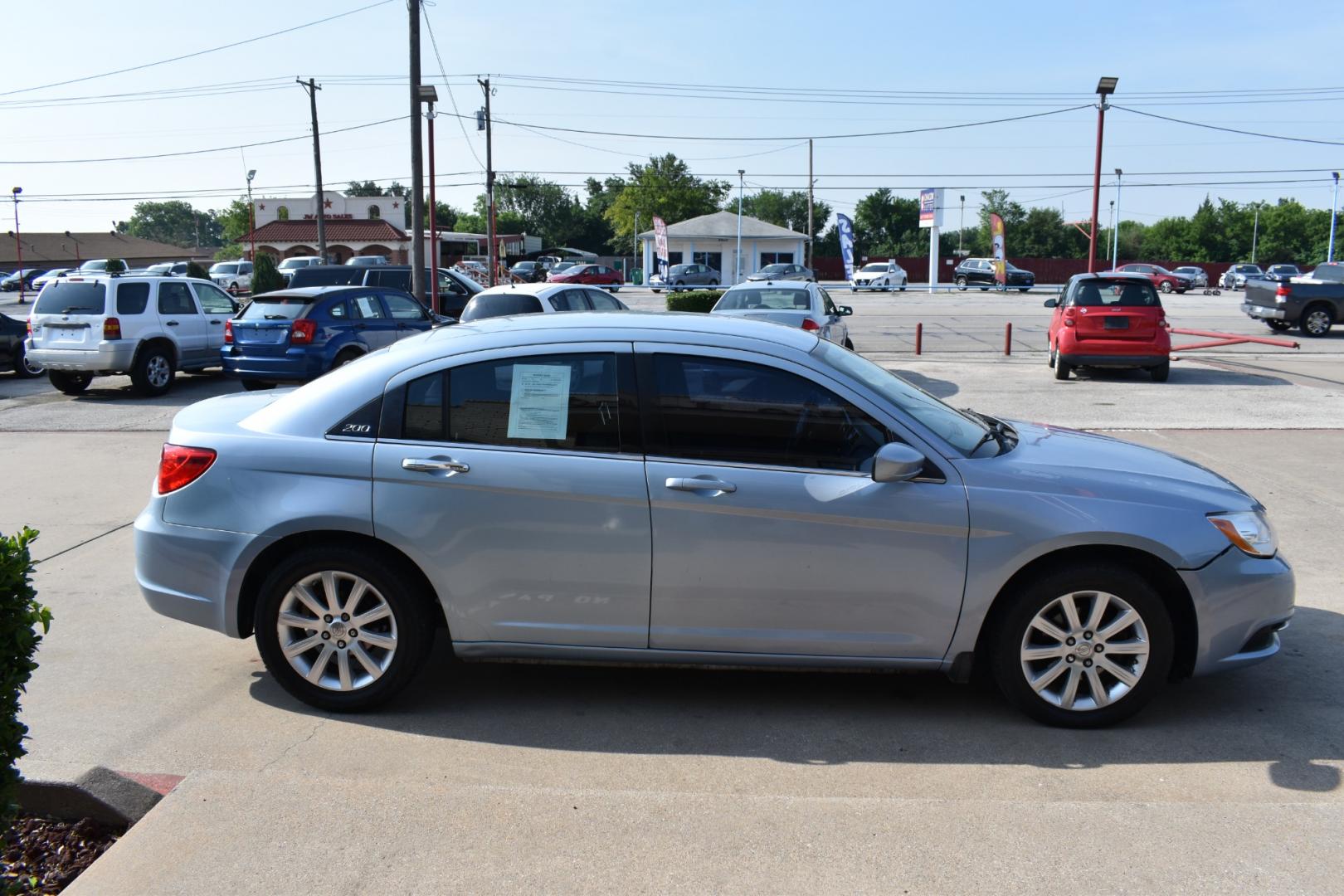 2013 Blue /Black Chrysler 200 Touring (1C3CCBBB5DN) with an 2.4L L4 DOHC 16V engine, 6-Speed Automatic transmission, located at 5925 E. BELKNAP ST., HALTOM CITY, TX, 76117, (817) 834-4222, 32.803799, -97.259003 - CASH ONLY $2,995 Plus TT&L Coupon does not apply. Purchasing a 2013 Chrysler 200 Touring can be a practical choice for several reasons: Affordability: The 2013 Chrysler 200 Touring is often available at a competitive price point in the used car market, making it an attractive option for budget-c - Photo#3