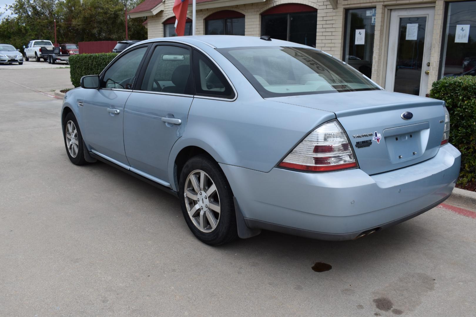 2008 Blue /Gray Ford Taurus SEL (1FAHP24W18G) with an 3.5L V6 DOHC 24V engine, 6-Speed Automatic Overdrive transmission, located at 5925 E. BELKNAP ST., HALTOM CITY, TX, 76117, (817) 834-4222, 32.803799, -97.259003 - Photo#2