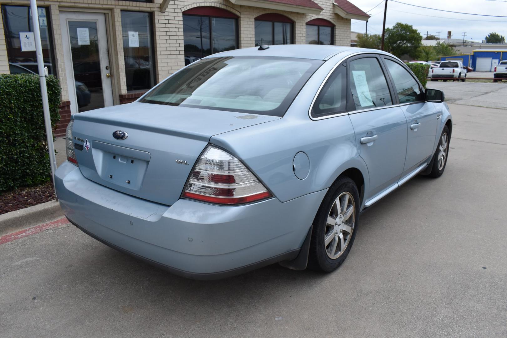 2008 Blue /Gray Ford Taurus SEL (1FAHP24W18G) with an 3.5L V6 DOHC 24V engine, 6-Speed Automatic Overdrive transmission, located at 5925 E. BELKNAP ST., HALTOM CITY, TX, 76117, (817) 834-4222, 32.803799, -97.259003 - Photo#4