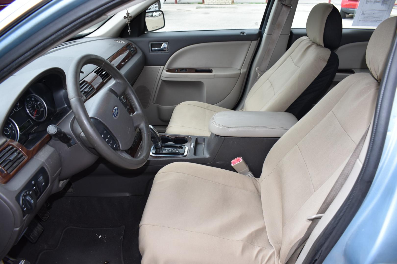 2008 Blue /Gray Ford Taurus SEL (1FAHP24W18G) with an 3.5L V6 DOHC 24V engine, 6-Speed Automatic Overdrive transmission, located at 5925 E. BELKNAP ST., HALTOM CITY, TX, 76117, (817) 834-4222, 32.803799, -97.259003 - Photo#8