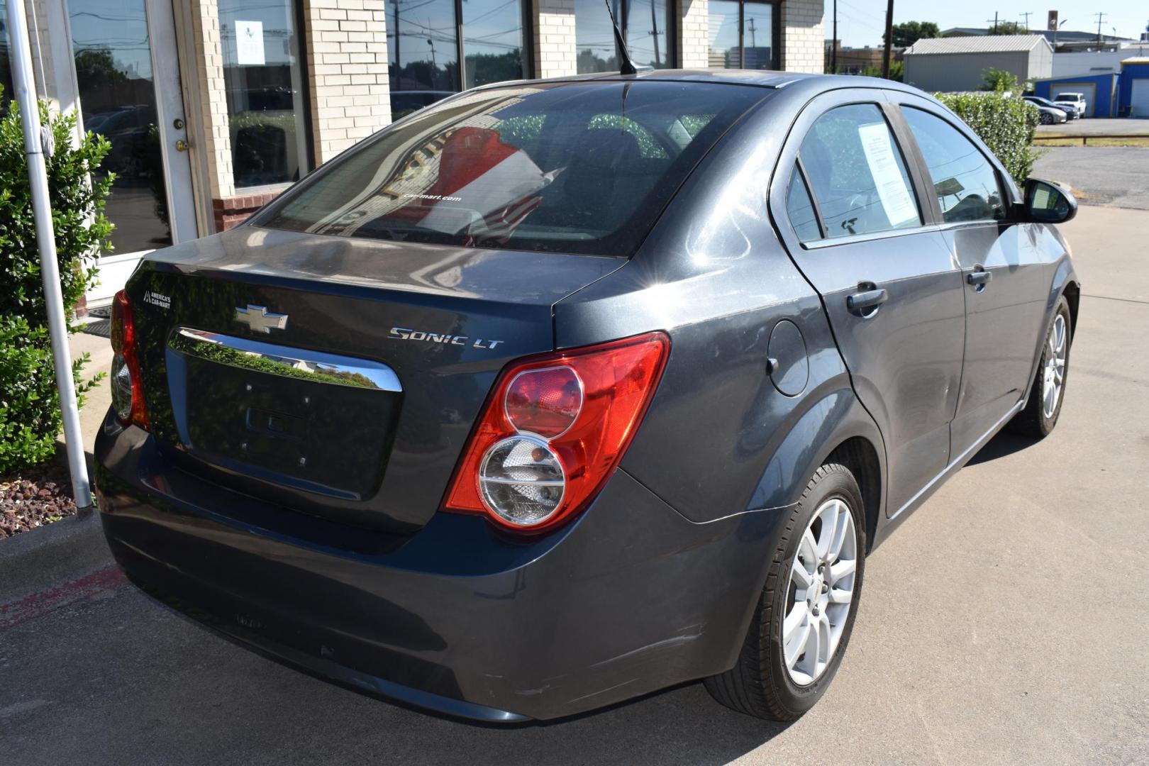 2012 Black /Gray Chevrolet Sonic (1G1JC5SH9C4) with an 4.1.8L engine, 6-Speed Automatic transmission, located at 5925 E. BELKNAP ST., HALTOM CITY, TX, 76117, (817) 834-4222, 32.803799, -97.259003 - Photo#3