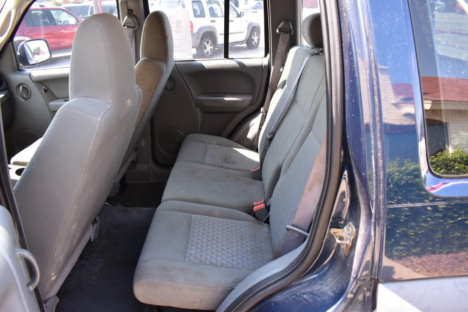 2005 Blue /Gray Jeep Liberty (1J4GK48K65W) with an 6 cylinder 3.71L engine, 4 SPEED AUTOMATIC transmission, located at 5925 E. BELKNAP ST., HALTOM CITY, TX, 76117, (817) 834-4222, 32.803799, -97.259003 - Buying a 2005 Jeep Liberty can offer several benefits: Off-road Capability: The Jeep Liberty is known for its ruggedness and off-road capability. It's equipped with features like four-wheel drive, solid axles, and ample ground clearance, making it suitable for tackling various terrains. Reliab - Photo#15