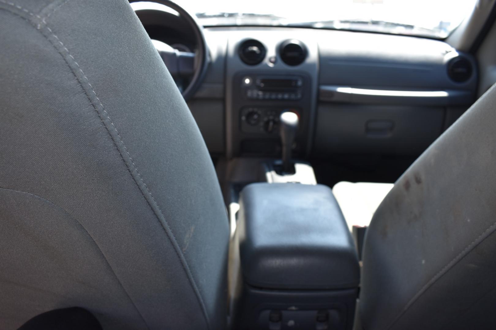 2005 Blue /Gray Jeep Liberty (1J4GK48K65W) with an 6 cylinder 3.71L engine, 4 SPEED AUTOMATIC transmission, located at 5925 E. BELKNAP ST., HALTOM CITY, TX, 76117, (817) 834-4222, 32.803799, -97.259003 - Buying a 2005 Jeep Liberty can offer several benefits: Off-road Capability: The Jeep Liberty is known for its ruggedness and off-road capability. It's equipped with features like four-wheel drive, solid axles, and ample ground clearance, making it suitable for tackling various terrains. Reliab - Photo#16