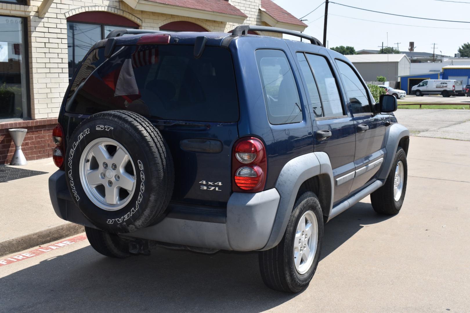 2005 Blue /Gray Jeep Liberty (1J4GK48K65W) with an 6 cylinder 3.71L engine, 4 SPEED AUTOMATIC transmission, located at 5925 E. BELKNAP ST., HALTOM CITY, TX, 76117, (817) 834-4222, 32.803799, -97.259003 - Buying a 2005 Jeep Liberty can offer several benefits: Off-road Capability: The Jeep Liberty is known for its ruggedness and off-road capability. It's equipped with features like four-wheel drive, solid axles, and ample ground clearance, making it suitable for tackling various terrains. Reliab - Photo#4