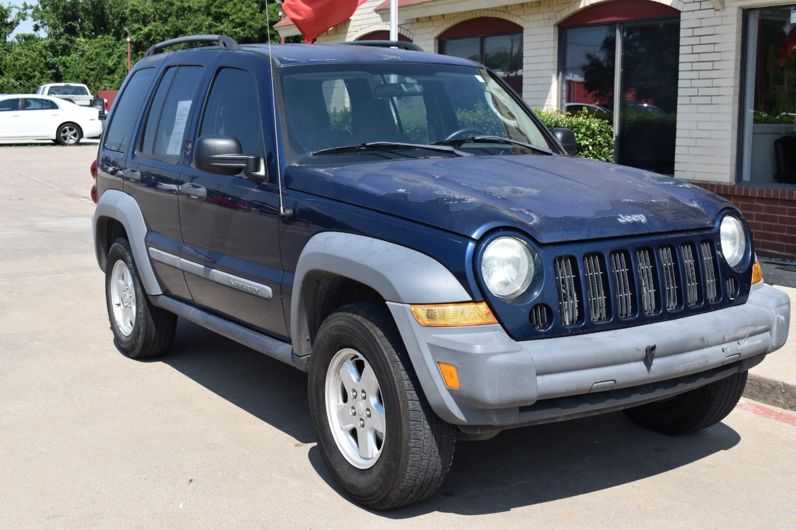 2005 Blue /Gray Jeep Liberty (1J4GK48K65W) with an 6 cylinder 3.71L engine, 4 SPEED AUTOMATIC transmission, located at 5925 E. BELKNAP ST., HALTOM CITY, TX, 76117, (817) 834-4222, 32.803799, -97.259003 - Buying a 2005 Jeep Liberty can offer several benefits: Off-road Capability: The Jeep Liberty is known for its ruggedness and off-road capability. It's equipped with features like four-wheel drive, solid axles, and ample ground clearance, making it suitable for tackling various terrains. Reliab - Photo#5