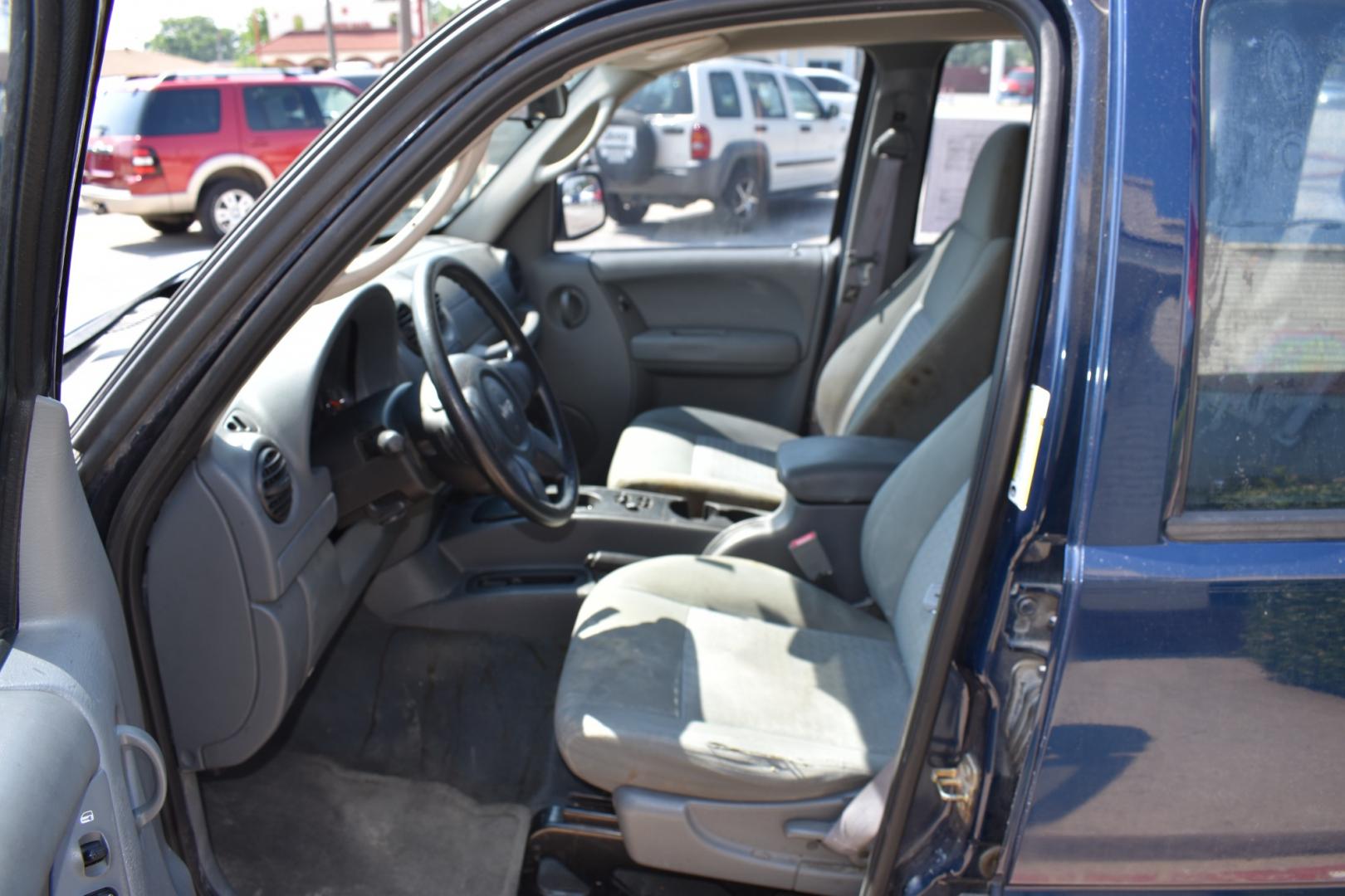 2005 Blue /Gray Jeep Liberty (1J4GK48K65W) with an 6 cylinder 3.71L engine, 4 SPEED AUTOMATIC transmission, located at 5925 E. BELKNAP ST., HALTOM CITY, TX, 76117, (817) 834-4222, 32.803799, -97.259003 - Buying a 2005 Jeep Liberty can offer several benefits: Off-road Capability: The Jeep Liberty is known for its ruggedness and off-road capability. It's equipped with features like four-wheel drive, solid axles, and ample ground clearance, making it suitable for tackling various terrains. Reliab - Photo#7