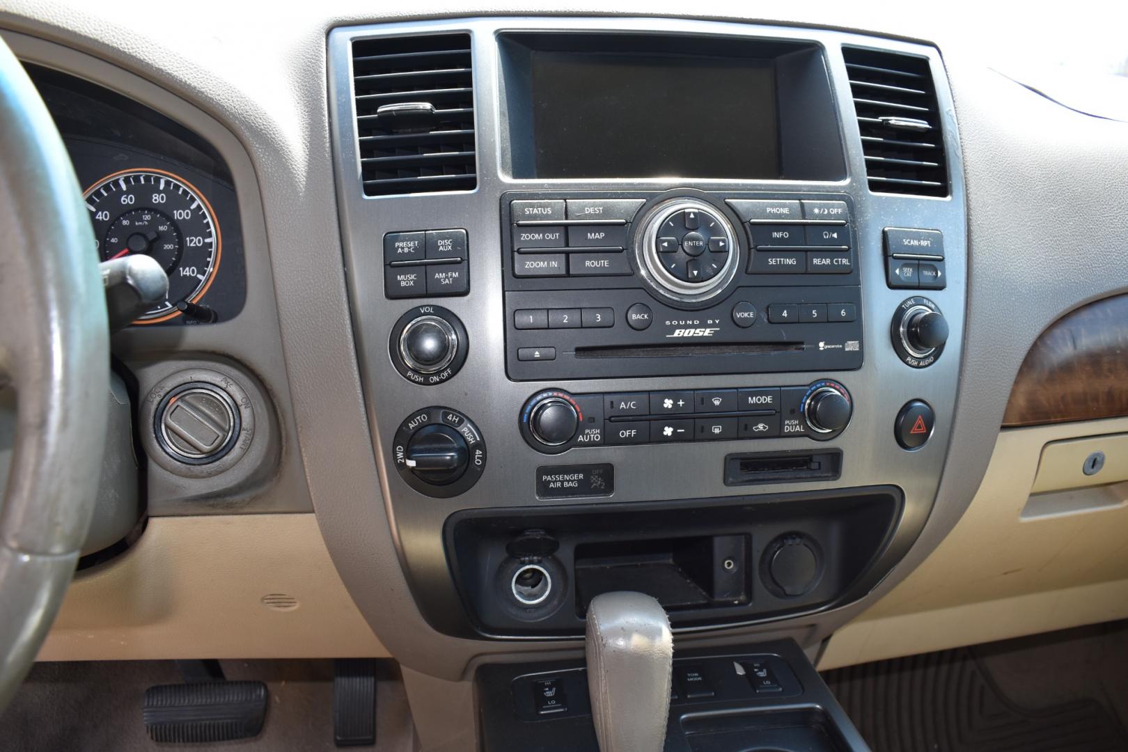 2009 Red /Tan Nissan Armada (5N1AA08C49N) with an V8 5.6 L engine, 5 SPEED AUTOMATIC transmission, located at 5925 E. BELKNAP ST., HALTOM CITY, TX, 76117, (817) 834-4222, 32.803799, -97.259003 - Buying a 2009 Nissan Armada offers several benefits: Powerful V8 Engine: The 2009 Nissan Armada is equipped with a robust 5.6-liter V8 engine, providing ample power for towing and hauling heavy loads. This engine delivers strong acceleration and performance, making it suitable for both daily driv - Photo#11