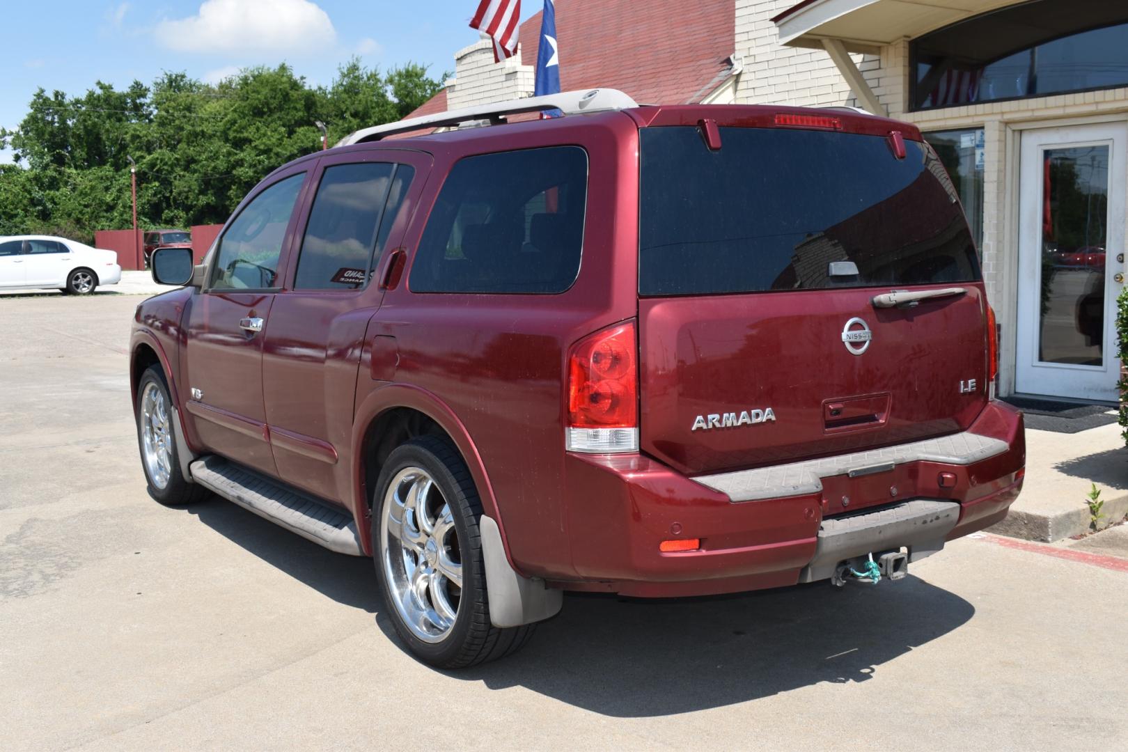 2009 Red /Tan Nissan Armada (5N1AA08C49N) with an V8 5.6 L engine, 5 SPEED AUTOMATIC transmission, located at 5925 E. BELKNAP ST., HALTOM CITY, TX, 76117, (817) 834-4222, 32.803799, -97.259003 - Buying a 2009 Nissan Armada offers several benefits: Powerful V8 Engine: The 2009 Nissan Armada is equipped with a robust 5.6-liter V8 engine, providing ample power for towing and hauling heavy loads. This engine delivers strong acceleration and performance, making it suitable for both daily driv - Photo#2