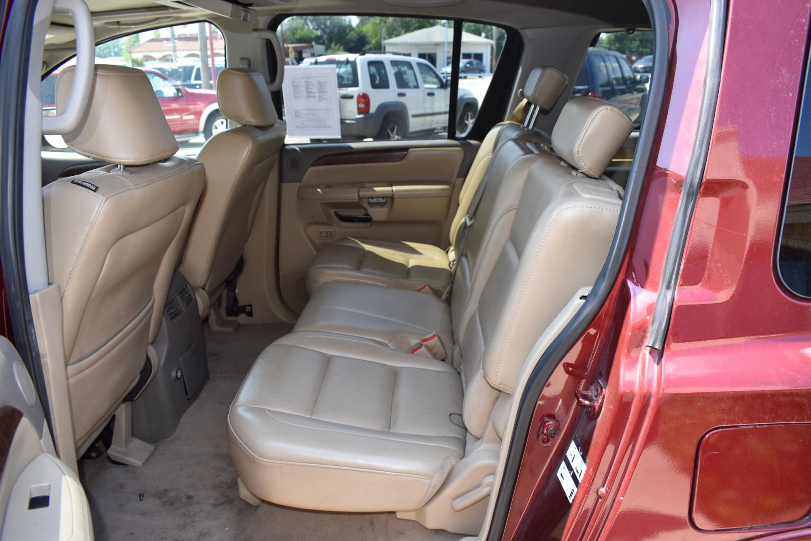 2009 Red /Tan Nissan Armada (5N1AA08C49N) with an V8 5.6 L engine, 5 SPEED AUTOMATIC transmission, located at 5925 E. BELKNAP ST., HALTOM CITY, TX, 76117, (817) 834-4222, 32.803799, -97.259003 - Buying a 2009 Nissan Armada offers several benefits: Powerful V8 Engine: The 2009 Nissan Armada is equipped with a robust 5.6-liter V8 engine, providing ample power for towing and hauling heavy loads. This engine delivers strong acceleration and performance, making it suitable for both daily driv - Photo#20