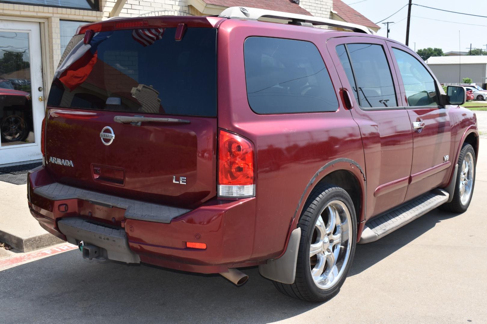 2009 Red /Tan Nissan Armada (5N1AA08C49N) with an V8 5.6 L engine, 5 SPEED AUTOMATIC transmission, located at 5925 E. BELKNAP ST., HALTOM CITY, TX, 76117, (817) 834-4222, 32.803799, -97.259003 - Buying a 2009 Nissan Armada offers several benefits: Powerful V8 Engine: The 2009 Nissan Armada is equipped with a robust 5.6-liter V8 engine, providing ample power for towing and hauling heavy loads. This engine delivers strong acceleration and performance, making it suitable for both daily driv - Photo#4