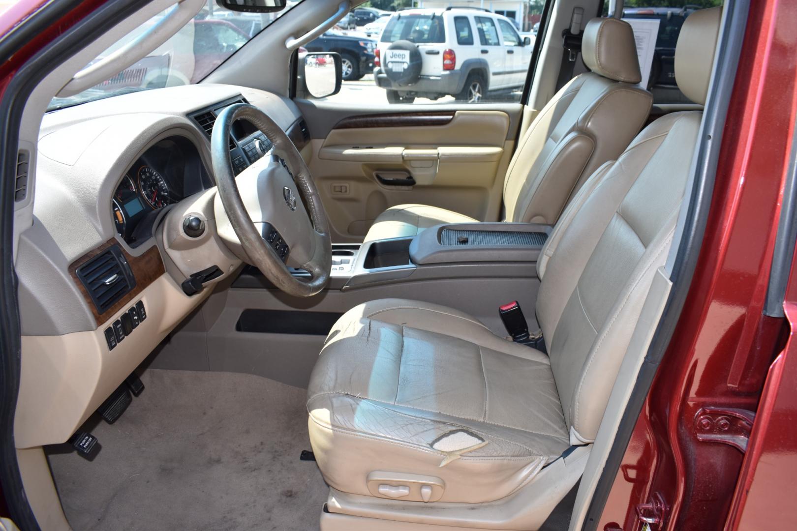 2009 Red /Tan Nissan Armada (5N1AA08C49N) with an V8 5.6 L engine, 5 SPEED AUTOMATIC transmission, located at 5925 E. BELKNAP ST., HALTOM CITY, TX, 76117, (817) 834-4222, 32.803799, -97.259003 - Buying a 2009 Nissan Armada offers several benefits: Powerful V8 Engine: The 2009 Nissan Armada is equipped with a robust 5.6-liter V8 engine, providing ample power for towing and hauling heavy loads. This engine delivers strong acceleration and performance, making it suitable for both daily driv - Photo#7