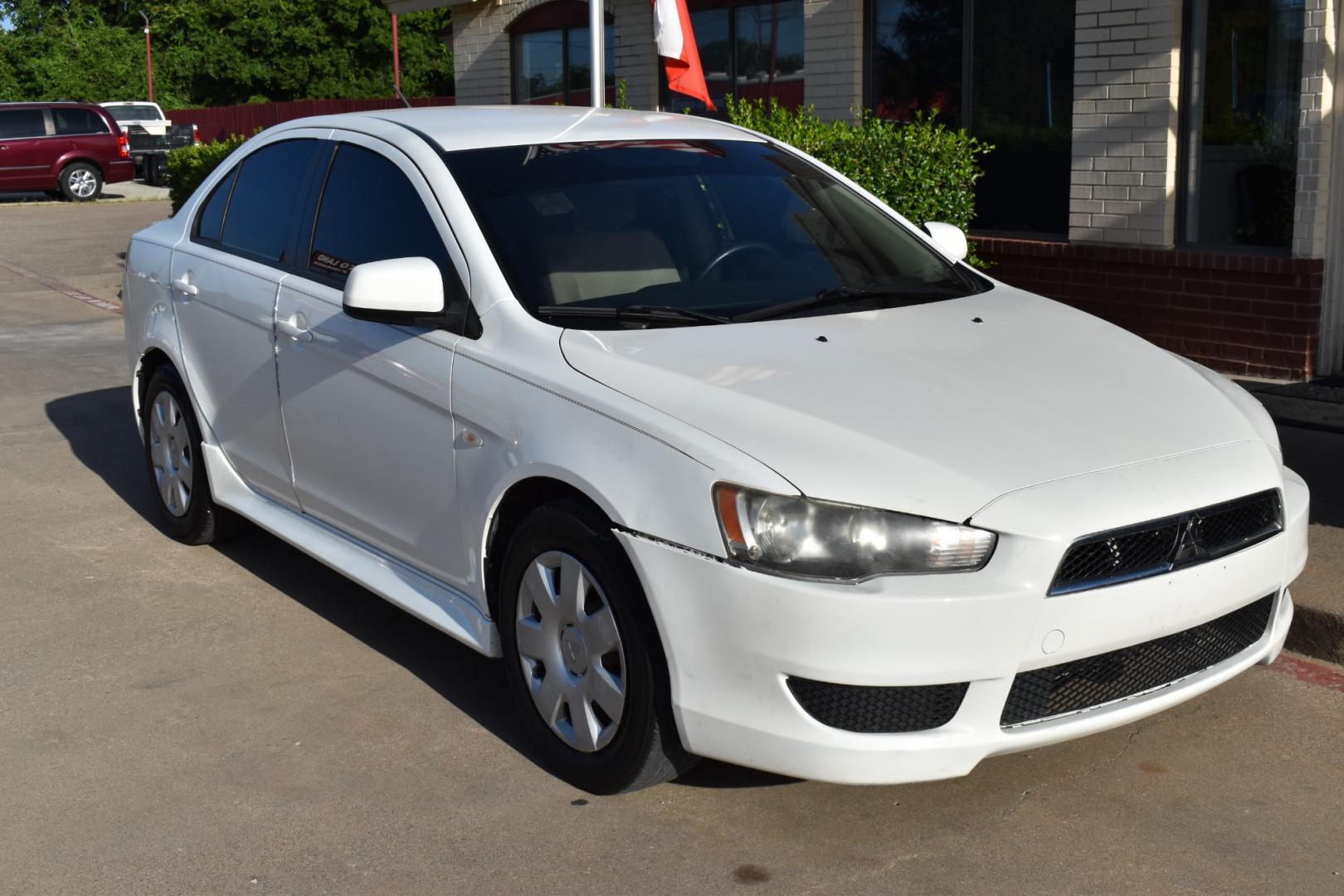 2011 White /Beige Mitsubishi Lancer (JA32U2FU8BU) with an 4 cylinder 2.0L engine, Automatic transmission, located at 5925 E. BELKNAP ST., HALTOM CITY, TX, 76117, (817) 834-4222, 32.803799, -97.259003 - Buying a 2011 Mitsubishi Lancer can have several benefits, depending on your needs and preferences: Affordability: Older model years like the 2011 Lancer tend to be more affordable compared to newer cars of the same model. This can save you money on the purchase price. Proven Design: By 2011, the - Photo#5