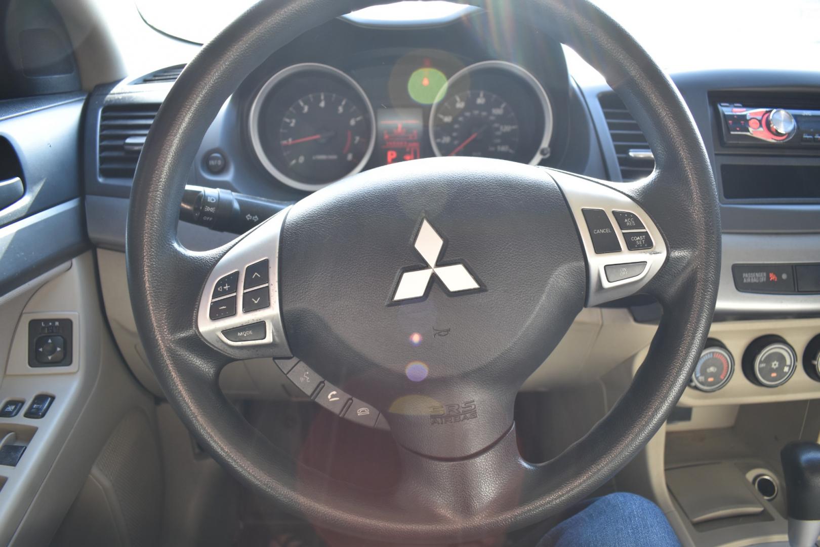 2011 White /Beige Mitsubishi Lancer (JA32U2FU8BU) with an 4 cylinder 2.0L engine, Automatic transmission, located at 5925 E. BELKNAP ST., HALTOM CITY, TX, 76117, (817) 834-4222, 32.803799, -97.259003 - Buying a 2011 Mitsubishi Lancer can have several benefits, depending on your needs and preferences: Affordability: Older model years like the 2011 Lancer tend to be more affordable compared to newer cars of the same model. This can save you money on the purchase price. Proven Design: By 2011, the - Photo#9