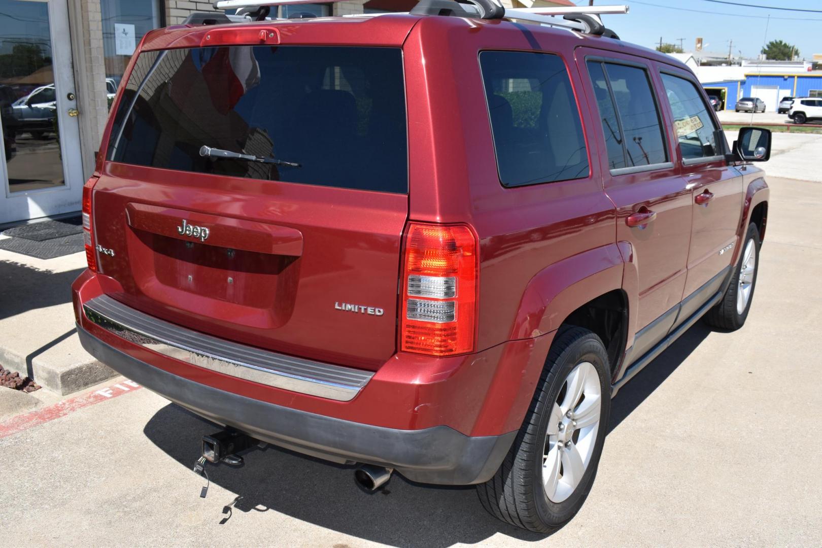 2012 Maroon /Black Jeep Patriot Limited 4WD (1C4NJRCB1CD) with an 2.4L L4 DOHC 16V engine, 4 SPEED AUTOMATIC 4X4 transmission, located at 5925 E. BELKNAP ST., HALTOM CITY, TX, 76117, (817) 834-4222, 32.803799, -97.259003 - Buying a 2012 Jeep Patriot can be a great choice if you're looking for a compact SUV with distinctive features and a rugged character. Here are some of the benefits of considering a 2012 Jeep Patriot: Off-Road Capability: The 2012 Jeep Patriot offers notable off-road capability, especially if you - Photo#4