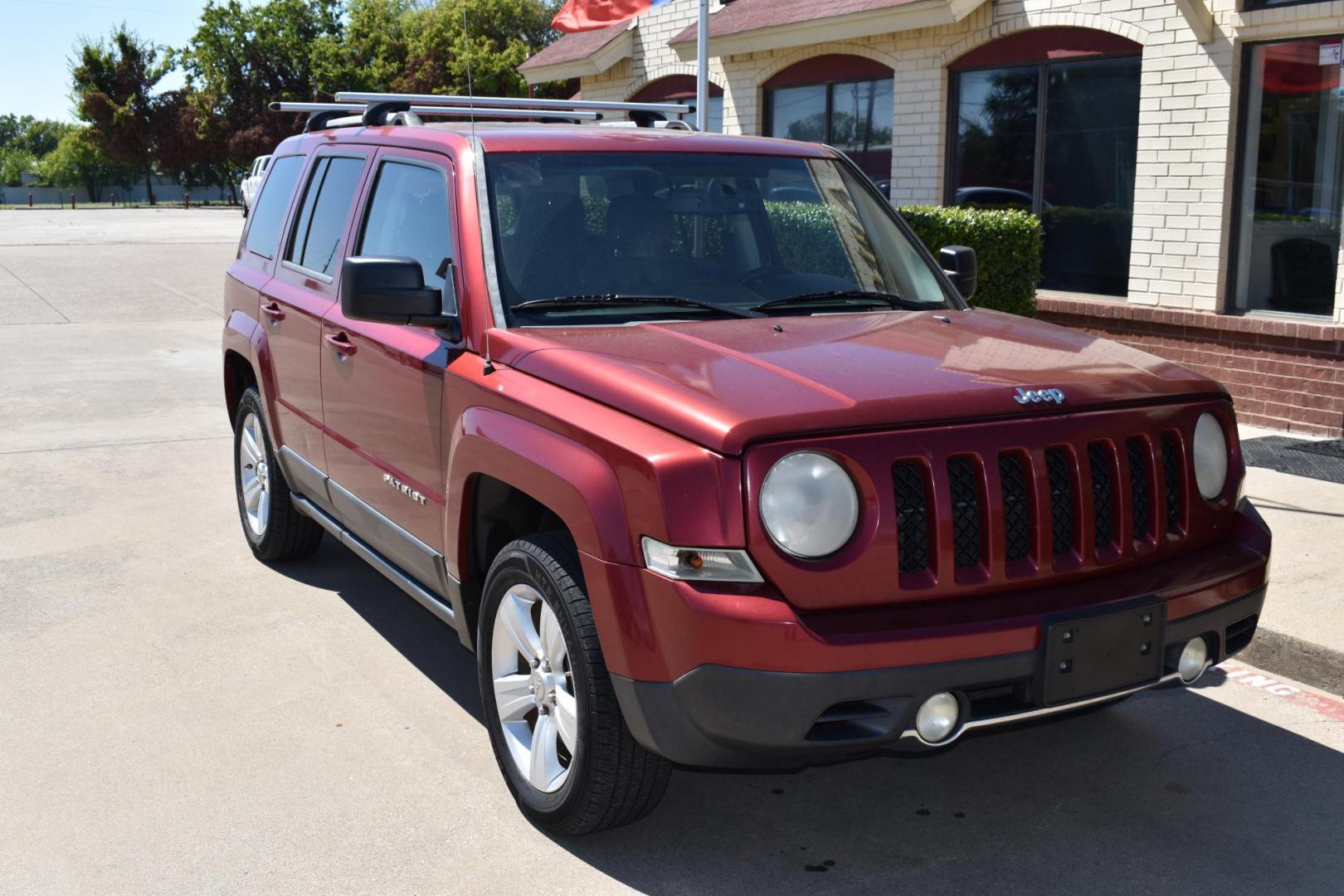 2012 Maroon /Black Jeep Patriot Limited 4WD (1C4NJRCB1CD) with an 2.4L L4 DOHC 16V engine, 4 SPEED AUTOMATIC 4X4 transmission, located at 5925 E. BELKNAP ST., HALTOM CITY, TX, 76117, (817) 834-4222, 32.803799, -97.259003 - Buying a 2012 Jeep Patriot can be a great choice if you're looking for a compact SUV with distinctive features and a rugged character. Here are some of the benefits of considering a 2012 Jeep Patriot: Off-Road Capability: The 2012 Jeep Patriot offers notable off-road capability, especially if you - Photo#5