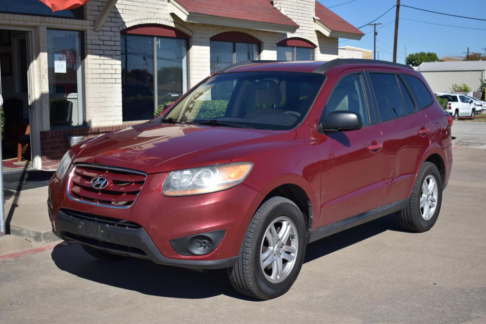 2011 Red /Gray Hyundai Santa Fe GLS 3.5 FWD (5XYZG4AG8BG) with an 3.5L V6 DOHC 24V engine, 6-Speed Automatic transmission, located at 5925 E. BELKNAP ST., HALTOM CITY, TX, 76117, (817) 834-4222, 32.803799, -97.259003 - The 2011 Hyundai Santa Fe GLS could be a solid option depending on your needs and preferences. Here's why you might consider buying it: 1. Affordability and Value Lower price: Being a 2011 model, you can often find it at a relatively low price compared to newer vehicles. This could offer great v - Photo#1