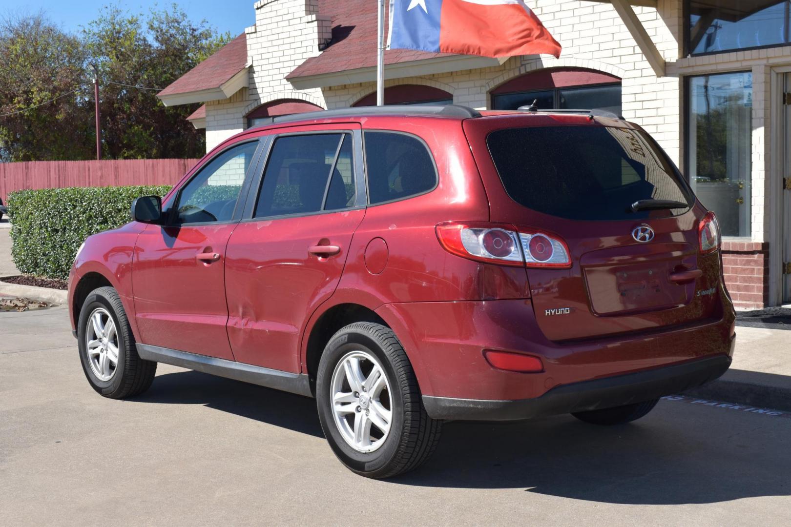 2011 Red /Gray Hyundai Santa Fe GLS 3.5 FWD (5XYZG4AG8BG) with an 3.5L V6 DOHC 24V engine, 6-Speed Automatic transmission, located at 5925 E. BELKNAP ST., HALTOM CITY, TX, 76117, (817) 834-4222, 32.803799, -97.259003 - The 2011 Hyundai Santa Fe GLS could be a solid option depending on your needs and preferences. Here's why you might consider buying it: 1. Affordability and Value Lower price: Being a 2011 model, you can often find it at a relatively low price compared to newer vehicles. This could offer great v - Photo#2