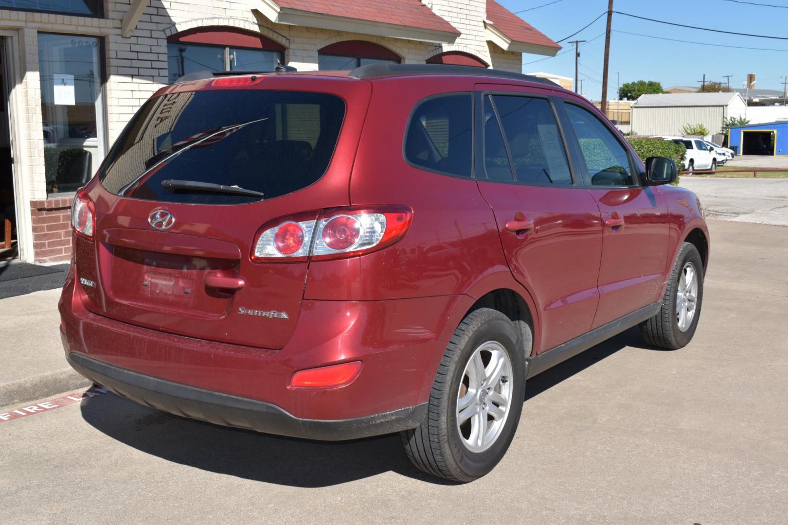 2011 Red /Gray Hyundai Santa Fe GLS 3.5 FWD (5XYZG4AG8BG) with an 3.5L V6 DOHC 24V engine, 6-Speed Automatic transmission, located at 5925 E. BELKNAP ST., HALTOM CITY, TX, 76117, (817) 834-4222, 32.803799, -97.259003 - The 2011 Hyundai Santa Fe GLS could be a solid option depending on your needs and preferences. Here's why you might consider buying it: 1. Affordability and Value Lower price: Being a 2011 model, you can often find it at a relatively low price compared to newer vehicles. This could offer great v - Photo#4