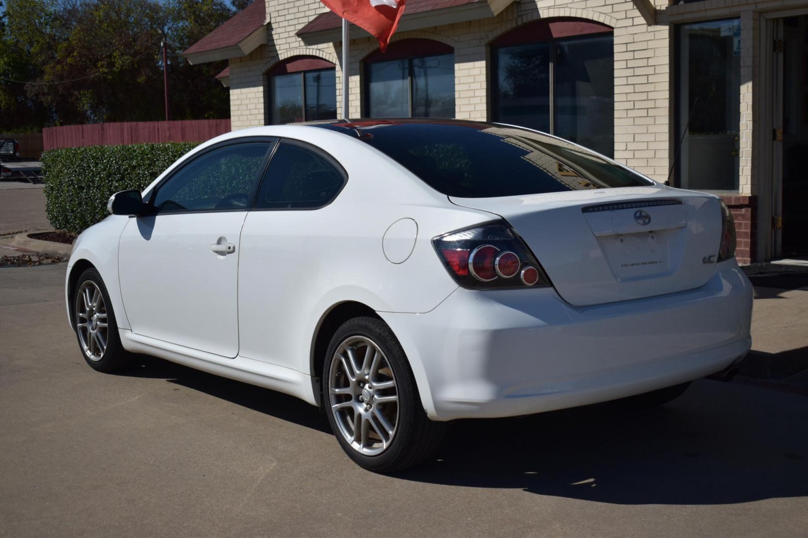 2008 White /Black Scion tC Sport Coupe (JTKDE167280) with an 2.4L L4 DOHC 16V engine, 4 SPEED AUTOMATIC transmission, located at 5925 E. BELKNAP ST., HALTOM CITY, TX, 76117, (817) 834-4222, 32.803799, -97.259003 - The 2008 Scion TC Sport Coupe could be an appealing choice if you’re looking for a budget-friendly, sporty, and customizable compact car with a reputation for reliability and fun-to-drive dynamics. Here’s why you might consider buying a 2008 Scion TC: 1. Sporty Design and Fun-to-Drive Attrac - Photo#2