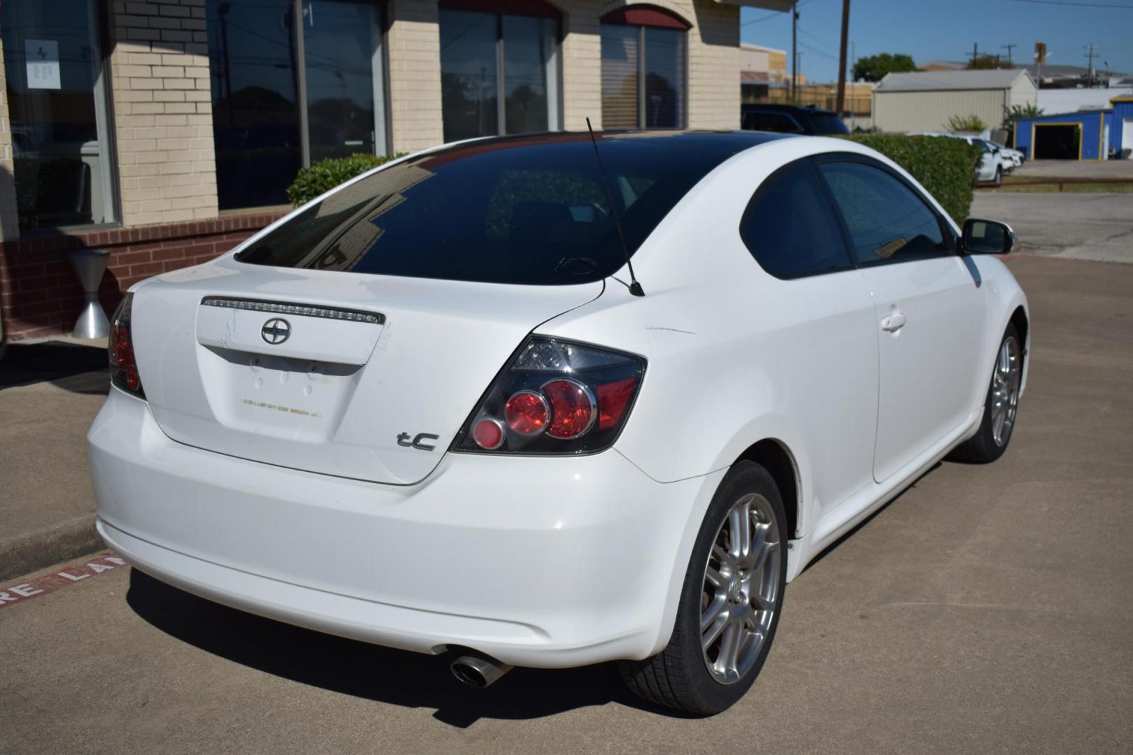 2008 White /Black Scion tC Sport Coupe (JTKDE167280) with an 2.4L L4 DOHC 16V engine, 4 SPEED AUTOMATIC transmission, located at 5925 E. BELKNAP ST., HALTOM CITY, TX, 76117, (817) 834-4222, 32.803799, -97.259003 - The 2008 Scion TC Sport Coupe could be an appealing choice if you’re looking for a budget-friendly, sporty, and customizable compact car with a reputation for reliability and fun-to-drive dynamics. Here’s why you might consider buying a 2008 Scion TC: 1. Sporty Design and Fun-to-Drive Attrac - Photo#4