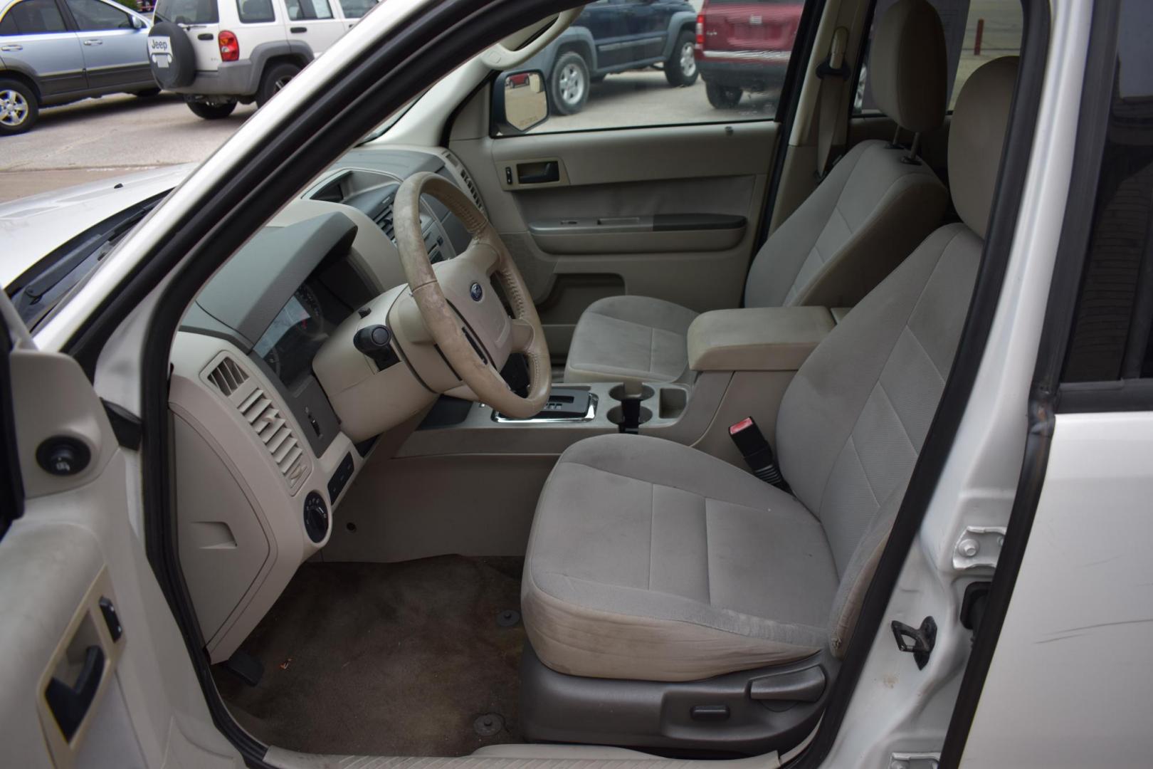 2011 White /Tan Ford Escape XLT FWD (1FMCU0D77BK) with an 2.5L L4 DOHC 16V engine, 6-Speed Automatic transmission, located at 5925 E. BELKNAP ST., HALTOM CITY, TX, 76117, (817) 834-4222, 32.803799, -97.259003 - The 2011 Ford Escape XLT FWD is a compact SUV that offers a solid mix of reliability, practicality, and versatility. Here are several reasons why you might consider buying this vehicle: 1. Strong Performance and Handling The 2011 Ford Escape XLT FWD comes with a 2.5-liter 4-cylinder engine that - Photo#7