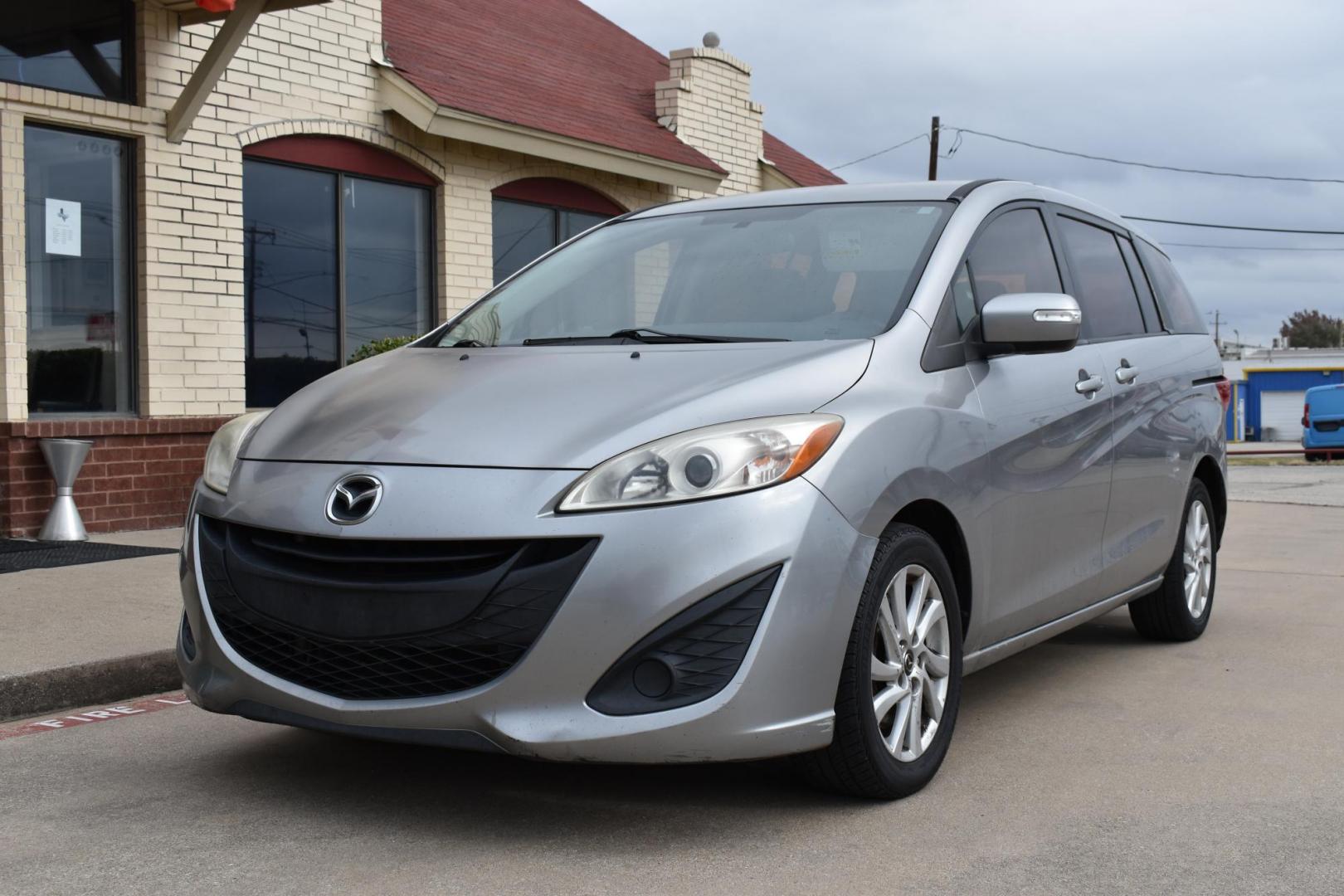 2013 Gray /Black Mazda MAZDA5 Sport AT (JM1CW2BL1D0) with an 2.5L L4 DOHC 16V engine, 5-Speed Automatic transmission, located at 5925 E. BELKNAP ST., HALTOM CITY, TX, 76117, (817) 834-4222, 32.803799, -97.259003 - Ah, the 2013 Mazda5! Here are some of its benefits: Versatility: The Mazda5 offers the practicality of a minivan with the maneuverability of a smaller car. Its sliding rear doors make it easy to access tight parking spaces and to get kids in and out. Seating: With seating for six, it has enoug - Photo#1