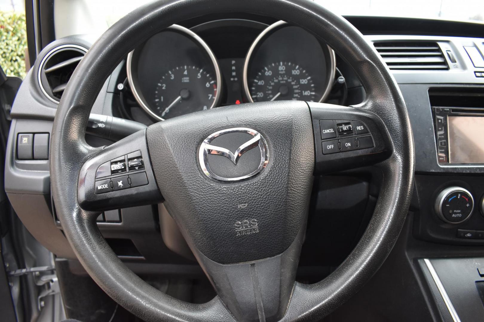 2013 Gray /Black Mazda MAZDA5 Sport AT (JM1CW2BL1D0) with an 2.5L L4 DOHC 16V engine, 5-Speed Automatic transmission, located at 5925 E. BELKNAP ST., HALTOM CITY, TX, 76117, (817) 834-4222, 32.803799, -97.259003 - Ah, the 2013 Mazda5! Here are some of its benefits: Versatility: The Mazda5 offers the practicality of a minivan with the maneuverability of a smaller car. Its sliding rear doors make it easy to access tight parking spaces and to get kids in and out. Seating: With seating for six, it has enoug - Photo#13