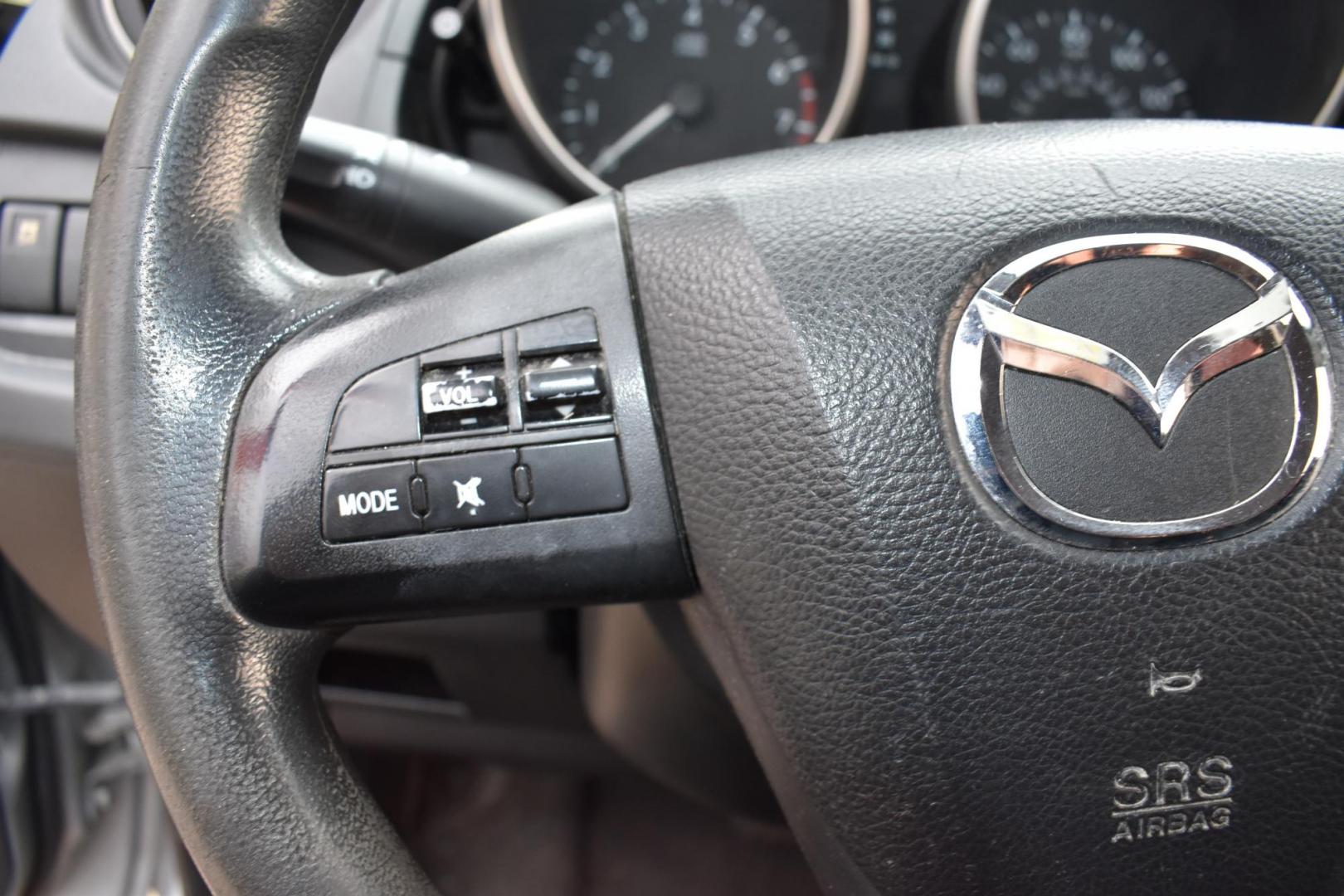 2013 Gray /Black Mazda MAZDA5 Sport AT (JM1CW2BL1D0) with an 2.5L L4 DOHC 16V engine, 5-Speed Automatic transmission, located at 5925 E. BELKNAP ST., HALTOM CITY, TX, 76117, (817) 834-4222, 32.803799, -97.259003 - Ah, the 2013 Mazda5! Here are some of its benefits: Versatility: The Mazda5 offers the practicality of a minivan with the maneuverability of a smaller car. Its sliding rear doors make it easy to access tight parking spaces and to get kids in and out. Seating: With seating for six, it has enoug - Photo#14