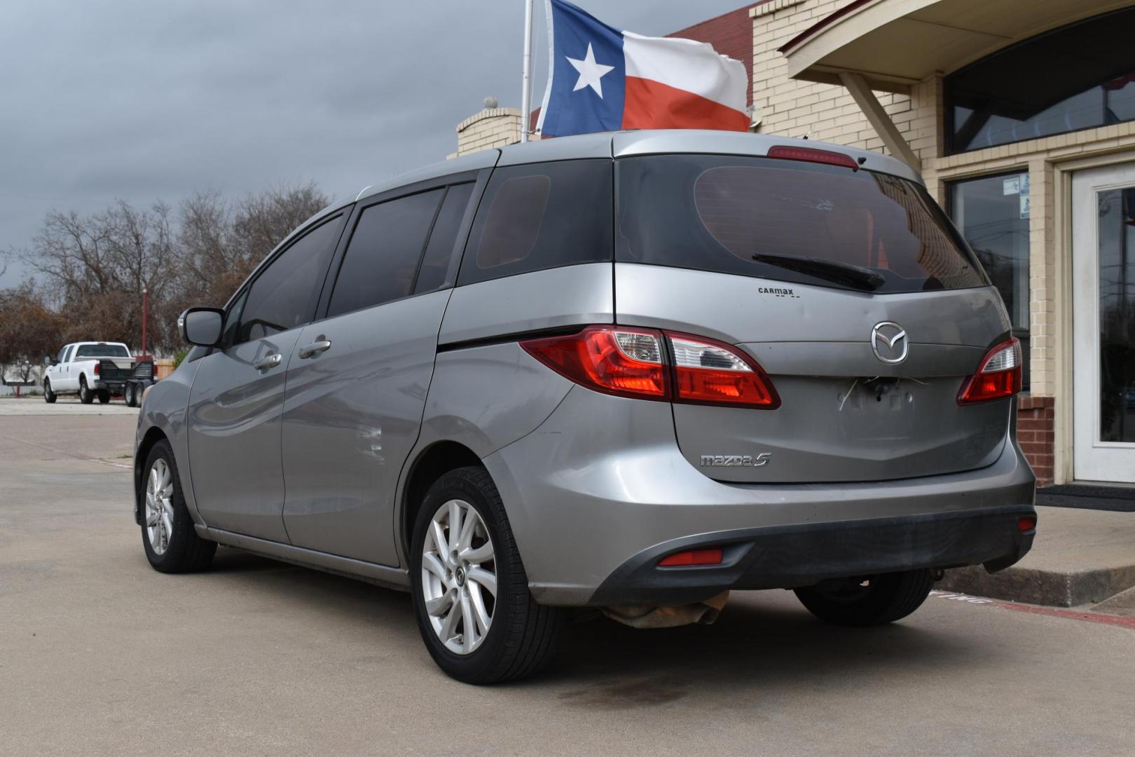 2013 Gray /Black Mazda MAZDA5 Sport AT (JM1CW2BL1D0) with an 2.5L L4 DOHC 16V engine, 5-Speed Automatic transmission, located at 5925 E. BELKNAP ST., HALTOM CITY, TX, 76117, (817) 834-4222, 32.803799, -97.259003 - Ah, the 2013 Mazda5! Here are some of its benefits: Versatility: The Mazda5 offers the practicality of a minivan with the maneuverability of a smaller car. Its sliding rear doors make it easy to access tight parking spaces and to get kids in and out. Seating: With seating for six, it has enoug - Photo#2