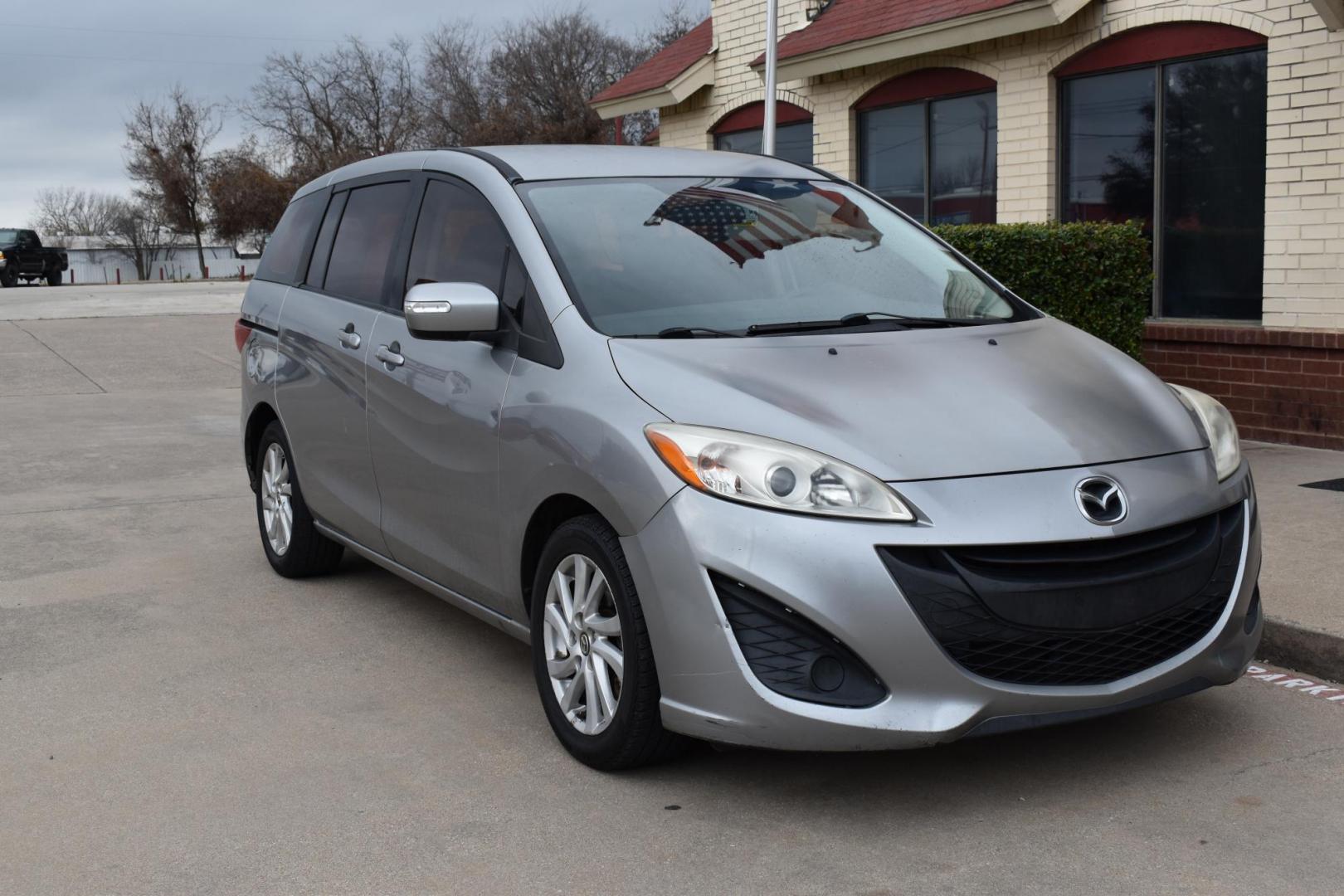 2013 Gray /Black Mazda MAZDA5 Sport AT (JM1CW2BL1D0) with an 2.5L L4 DOHC 16V engine, 5-Speed Automatic transmission, located at 5925 E. BELKNAP ST., HALTOM CITY, TX, 76117, (817) 834-4222, 32.803799, -97.259003 - Ah, the 2013 Mazda5! Here are some of its benefits: Versatility: The Mazda5 offers the practicality of a minivan with the maneuverability of a smaller car. Its sliding rear doors make it easy to access tight parking spaces and to get kids in and out. Seating: With seating for six, it has enoug - Photo#5