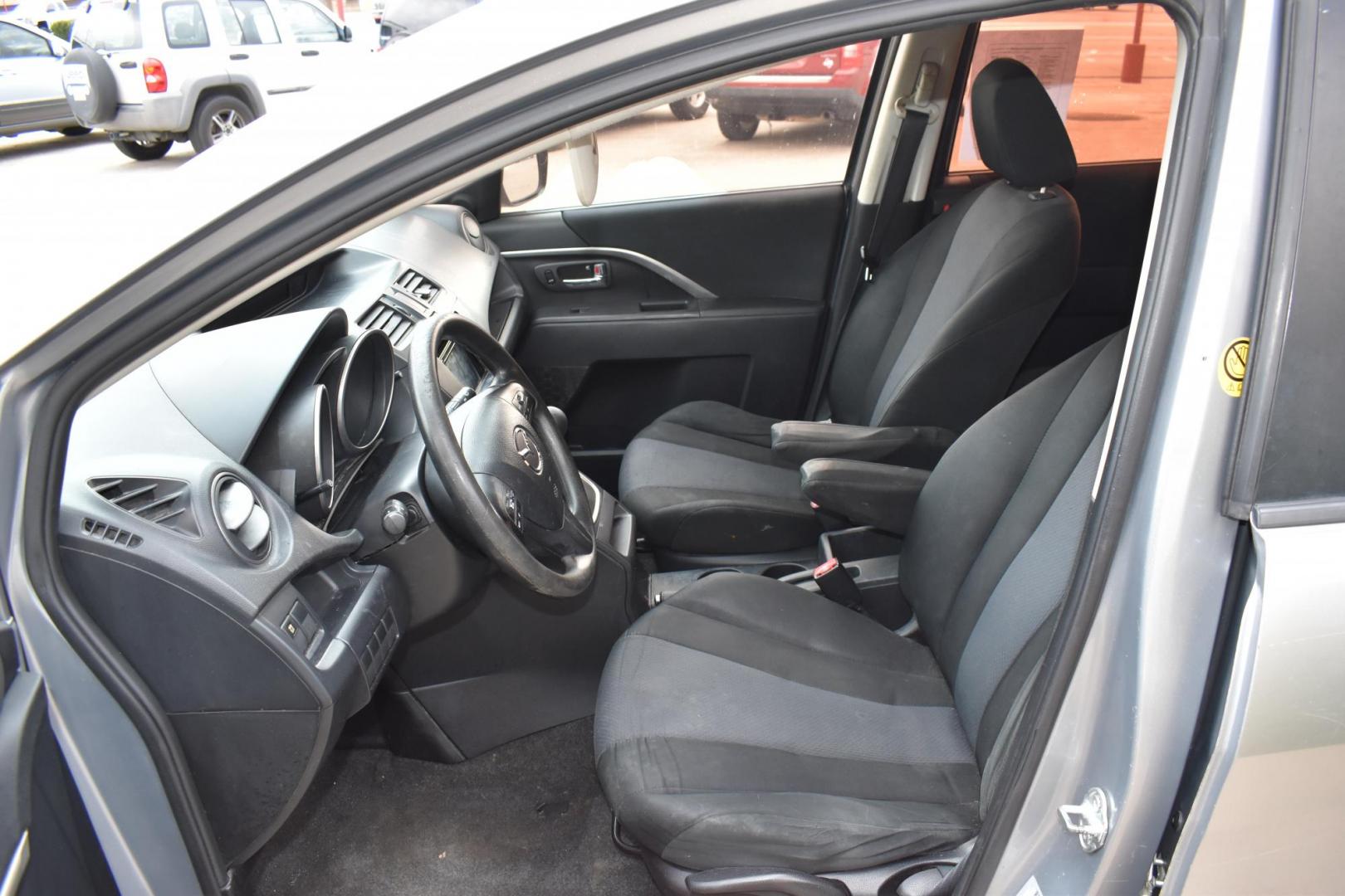 2013 Gray /Black Mazda MAZDA5 Sport AT (JM1CW2BL1D0) with an 2.5L L4 DOHC 16V engine, 5-Speed Automatic transmission, located at 5925 E. BELKNAP ST., HALTOM CITY, TX, 76117, (817) 834-4222, 32.803799, -97.259003 - Ah, the 2013 Mazda5! Here are some of its benefits: Versatility: The Mazda5 offers the practicality of a minivan with the maneuverability of a smaller car. Its sliding rear doors make it easy to access tight parking spaces and to get kids in and out. Seating: With seating for six, it has enoug - Photo#8